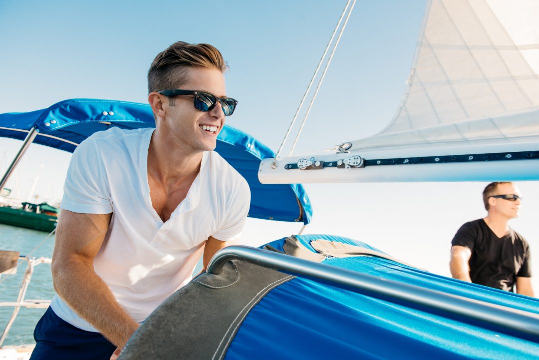 friends enjoying view on sailboat